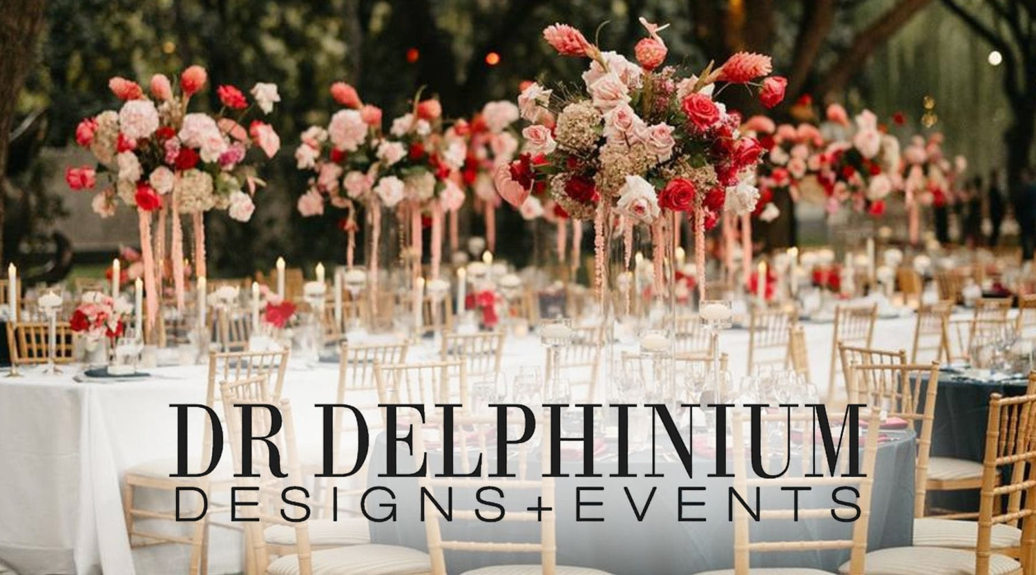 Table Arranged With Flowers. Text Below Reads "DR DELPHINIUM DESIGNS + EVENTS" - DBANDREA
