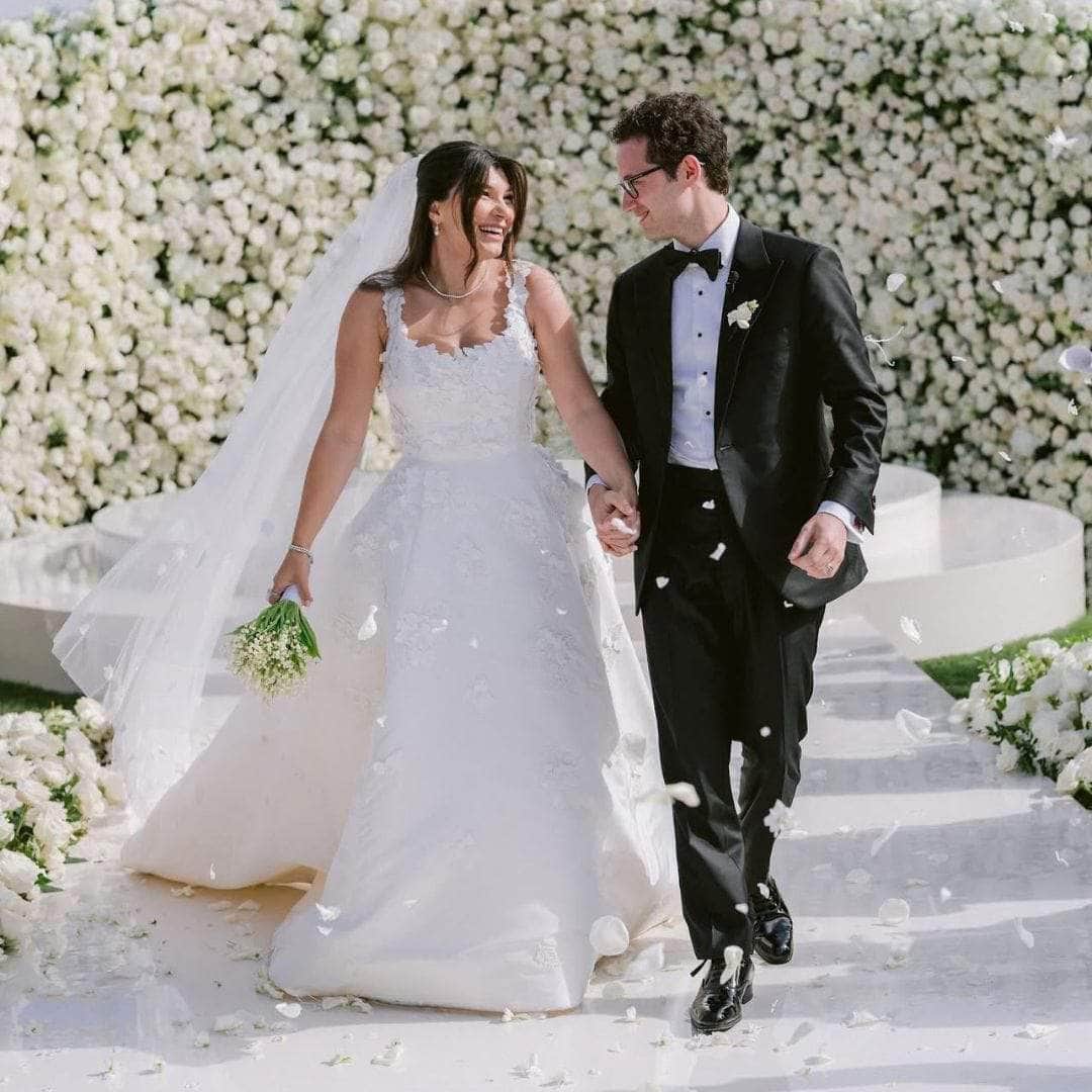 Bride and groom walking down aisle - dbandrea